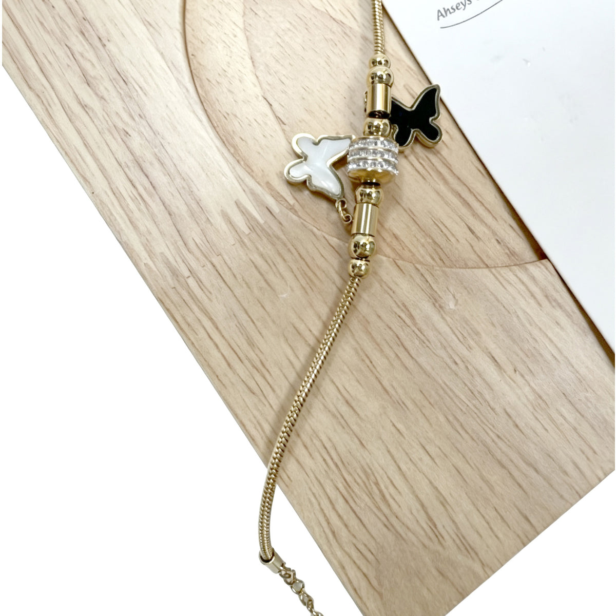 Gold-Tone Bracelet with Black & White Butterfly Charms