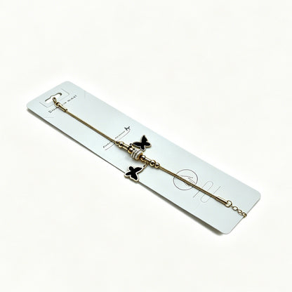 Gold Bracelet with Double Black Butterfly Charms