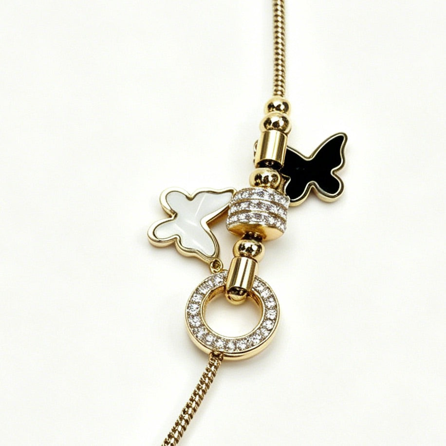 Gold-Tone Bracelet with Black & White Butterfly Charms