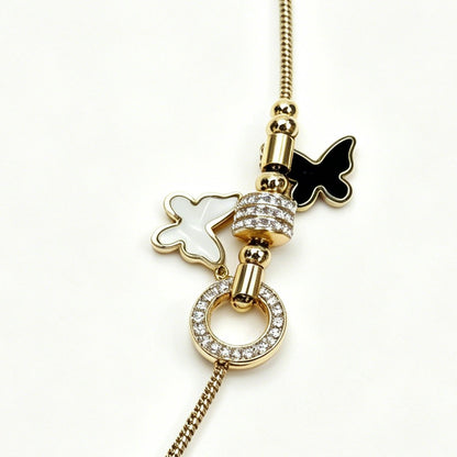 Gold-Tone Bracelet with Black & White Butterfly Charms