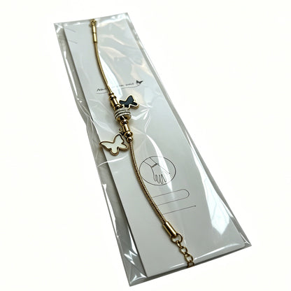 Gold-Tone Bracelet with Black & White Butterfly Charms