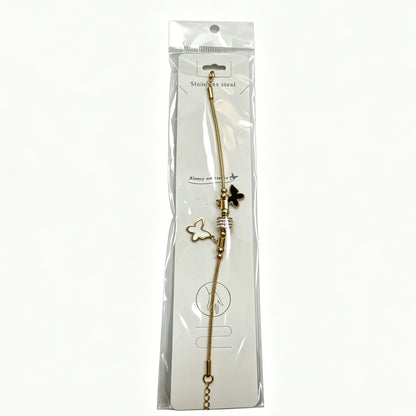 Gold-Tone Bracelet with Black & White Butterfly Charms